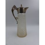 A HALLMARKED SILVER MOUNTED CUT GLASS CLARAT JUG, DATED 1928. APPROXIMATE HEIGHT 28.5cms.