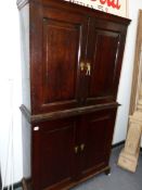 A 19th.C.OAK CABINET WITH FITTED DRAWERS AND PANEL DOORS WITH A SHELVED UPPER SECTION. W.106 x H.