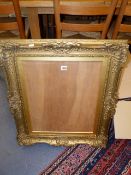 A SWEPT GILT FRAME IN THE FRENCH STYLE TOGETHER WITH AN 18th.C.STYLE GILT FRAME AND TWO MOULDED