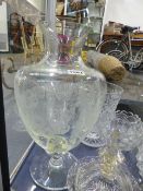 A GLASS OVOID VASE WITH ACID ETCHED GARLANDS OF FLOWERS ON A CIRCULAR PEDESTAL FOOT. H.40cms