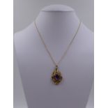A PRECIOUS YELLOW METAL TESTED AS GOLD VICTORIAN ROCOCO REVIVAL AMETHYST REMODELLED PENDANT.