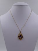 A PRECIOUS YELLOW METAL TESTED AS GOLD VICTORIAN ROCOCO REVIVAL AMETHYST REMODELLED PENDANT.