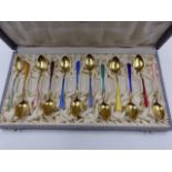 A CASED SET OF TWELVE NORWEGIAN GILDED AND ENAMELLED TEA SPOONS, STAMPED 925 S, THE CASE IS SIGNED