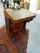 A FINE MID VICTORIAN ROSEWOOD DAVENPORT WRITING DESK WITH FRET DECORATED PANEL SIDES ENCLOSING