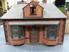 A LARGE EDWARDIAN DOLL'S HOUSE WITH DOUBLE BAY WINDOWS.