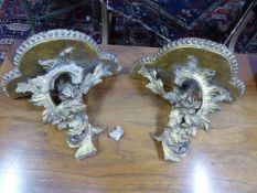 A PAIR OF VICTORIAN GILT ITALIANATE SCROLL FORM WALL BRACKETS.