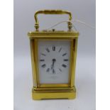 AN ANTIQUE BRASS CASED FIVE GLASS CARRIAGE CLOCK WITH WHITE ENAMEL DIAL SIGNED J W BENSON, 8-DAY