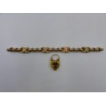 A VICTORIAN YELLOW METAL FANCY LINK BRACELET. THE ROUND FACETED EDGED BELCHER LINKS ARE JOINED