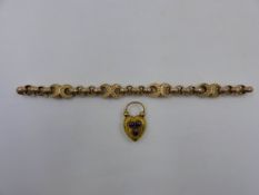 A VICTORIAN YELLOW METAL FANCY LINK BRACELET. THE ROUND FACETED EDGED BELCHER LINKS ARE JOINED