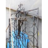 A PAIR OF WROUGHT IRON DRIVEWAY GATES.