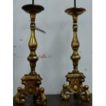 A PAIR OF ANTIQUE HEAVY FLEMISH BRASS PRICKET CANDLESTICKS NOW MOUNTED AS LAMPS. OVERALL H.64cms.