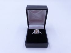 AN 18ct WHITE GOLD BRILLIANT CUT DIAMOND RING SET IN A SQUARE HALO OF DIAMONDS JOINED TO A MICRO