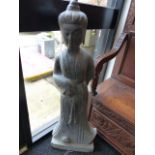 A CHINESE CARVED STONE GARDEN FIGURE OF A STANDING DEITY. H.110cms.