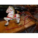 A TRI-ANG TINPLATE ROCKING HORSE.