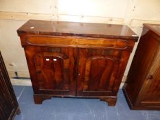 AN EARLY 19th.C.ROSEWOOD SIDE CABINET WITH FRIEZE DRAWER OVER PANELLED DOORS. W.91 x H.87cms.