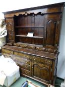 A LARGE GOOD QUALITY BESPOKE GEO.III.STYLE OAK DRESSER AND PLATE RACK. W.197 x H.207cms.