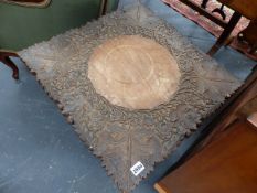 AN ANTIQUE EASTERN CARVED HARDWOOD OCCASIONAL TABLE WITH CABINET BASE AND A SIMILAR SMALLER