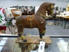 A 19th.C.FOLK ART HAND PAINTED MODEL HORSE ON WHEELED BASE AND ASSOCIATED PAINTED FLAT BED FARM