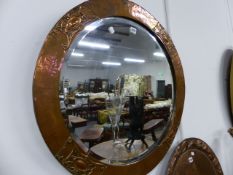 A LARGE ARTS AND CRAFTS COPPER FRAMED CIRCULAR WALL MIRROR. Dia.75cms.