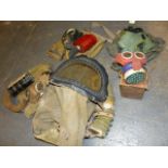 A MICKEY MOUSE GAS MASK AND BOX, FOUR CIVILIAN GAS MASKS, A BABY'S GAS MASK, THREE MILITARY GAS