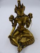 A POLISHED BRONZE TIBETAN FIGURE OF A SEATED DEITY ON LOTUS BASE. H.18cms.