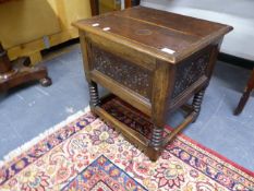 AN ANTIQUE OAK COFFERETTE BOX ON BOBBIN TURNED SUPPORTS UNITED BY STRETCHER. W.53 x H.55cms.