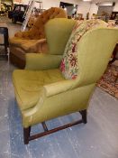 AN ANTIQUE MAHOGANY GEORGIAN STYLE WING BACK ARMCHAIR WITH NEEDLEPOINT BACK PANEL ON STRAIGHT