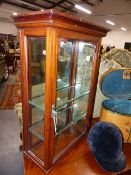 AN ANTIQUE MAHOGANY SMALL MIRROR BACK DISPENSARY CABINET WITH GLASS SHELVES. W.47 x H.69cms.