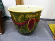 A MINTON'S STYLE ART POTTERY JARDINIERE DECORATED WITH SWAGS AND BOW KNOTS. H.35cms.