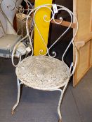 A PAIR OF ANTIQUE WROUGHT IRON SCROLL FORM GARDEN ARMCHAIRS.