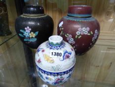 AN ORIENTAL FAMILLE ROSE BUTTERFLY DECORATED COVERED BOWL TOGETHER WITH TWO CLOISONNE COVERED GINGER