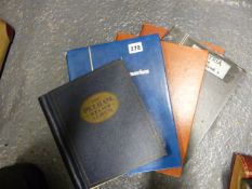 A COLLECTION OF WORLD STAMPS IN ALBUM AND FOUR STOCK BOOKS.