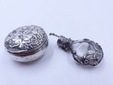 A SILVER HINGED PILL BOX WITH A GILDED INNER, ENGRAVED STERLING 925 FINE, WITH AN ALL OVER CLOVER