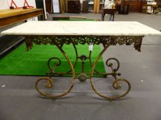 AN ANTIQUE FRENCH WROUGHT IRON MARBLE TOP BAKER'S TABLE WITH PIERCED APRON AND SCROLL SUPPORTS. H.81