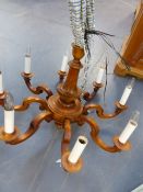 A CARVED FRENCH PROVINCIAL STYLE EIGHT LIGHT CHANDELIER. H.60 x Dia.85cms.