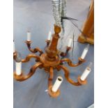 A CARVED FRENCH PROVINCIAL STYLE EIGHT LIGHT CHANDELIER. H.60 x Dia.85cms.