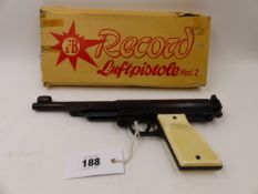 A .22 BOXED RECORD AIR PISTOL MOD.2, TWO PIECE WHITE PLASTIC GRIPS.