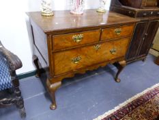 AN 18th.C.AND LATER OAK AND WALNUT LOWBOY WITH TWO SHORT AND ONE DEEP DRAWER STANDING ON CABRIOLE