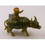 A CHINESE CARVED JADE FIGURAL GROUP OF A BOY RIDING A WATER BUFFALO. H.14.5cms.