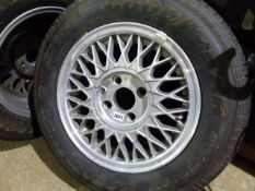 A SET OF FIVE MODERN ALLOY WHEELS WITH FOUR STUD FIXING FITTED WITH 185/70R14 GOODYEAR TYRES.