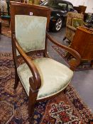 A PAIR OF ANTIQUE MAHOGANY BIEDERMEIER STYLE ARMCHAIRS WITH SCROLL ARMS AND SABRE LEGS.