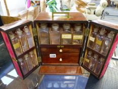 A 19th.C.MAHOGANY APOTHECARY CABINET WITH FITTED INTERIOR AND FULL COMPLIMENT OF BOTTLES, SCALES,