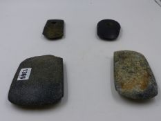 FOUR EARLY CHINESE STONE IMPLEMENTS (CELTS). LARGEST 13 x 10cms.