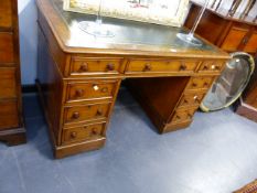 A GOOD QUALITY VICTORIAN OAK TWIN PEDESTAL WRITING DESK WITH TOOLED LEATHER INSET TOP OVER AN