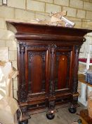 A 19th.C.DUTCH OAK SIDE CABINET WITH CARVED DECORATED PANEL DOORS FLANKED BY COLUMNS. W.167cms AT