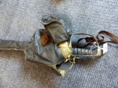 AN 1897 PATTERN GVR OFFICER'S SWORD BY ARMY & NAVY WITH FIELD SERVICE SCABBARD AND BAG.