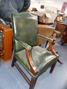 A GEORGIAN STYLE MAHOGANY AND LEATHER UPHOLSTERED DESK ARMCHAIR.