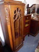 AN INTERESTING PAIR OF ART DECO PERIOD TALL OAK SHELVED CABINETS WITH GLAZED DOORS. W.65 x H.