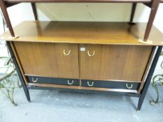 A MID CENTURY MAHOGANY AND EBONISED SIDEBOARD.