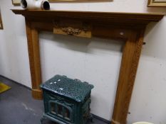 A CARVED PINE GEORGIAN STYLE MANTLEPIECE. H.127 x W.157cms.